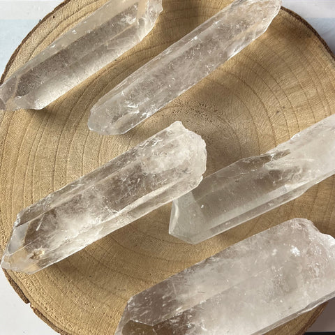 Clear crystal points on a wooden surface