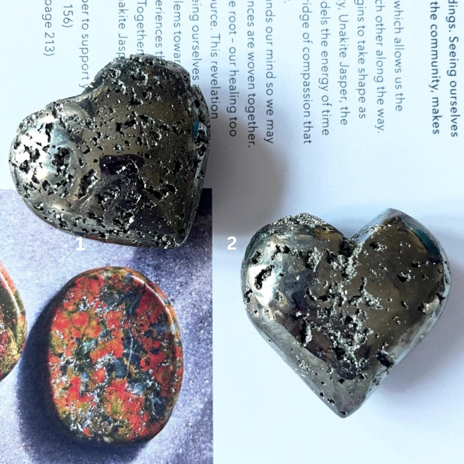 Pyramid heart held in a hand with a printed document in the background