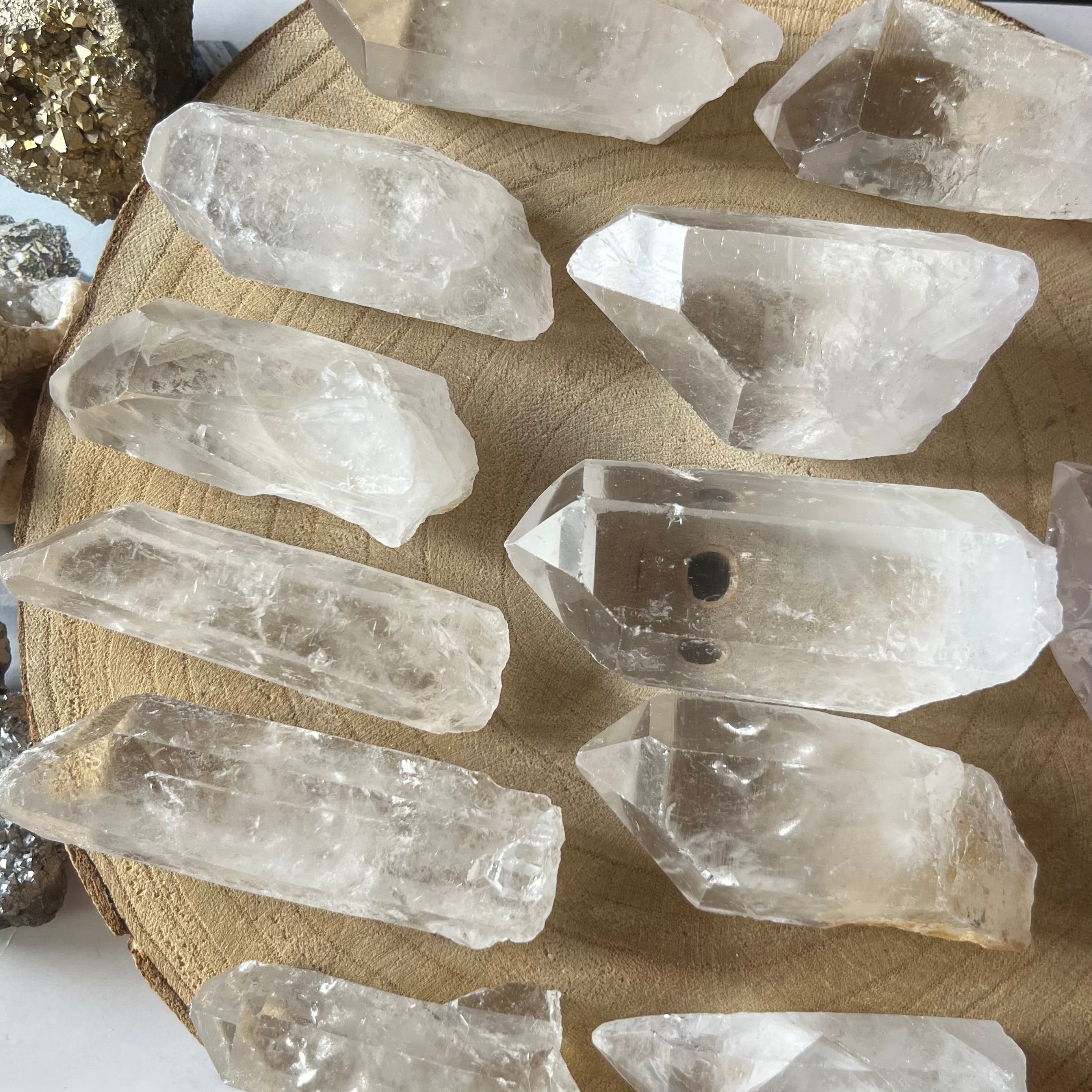 Collection of crystal rocks on a wooden surface