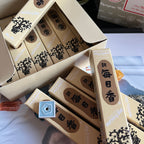 Packaged incense sticks with visible branding on a white surface