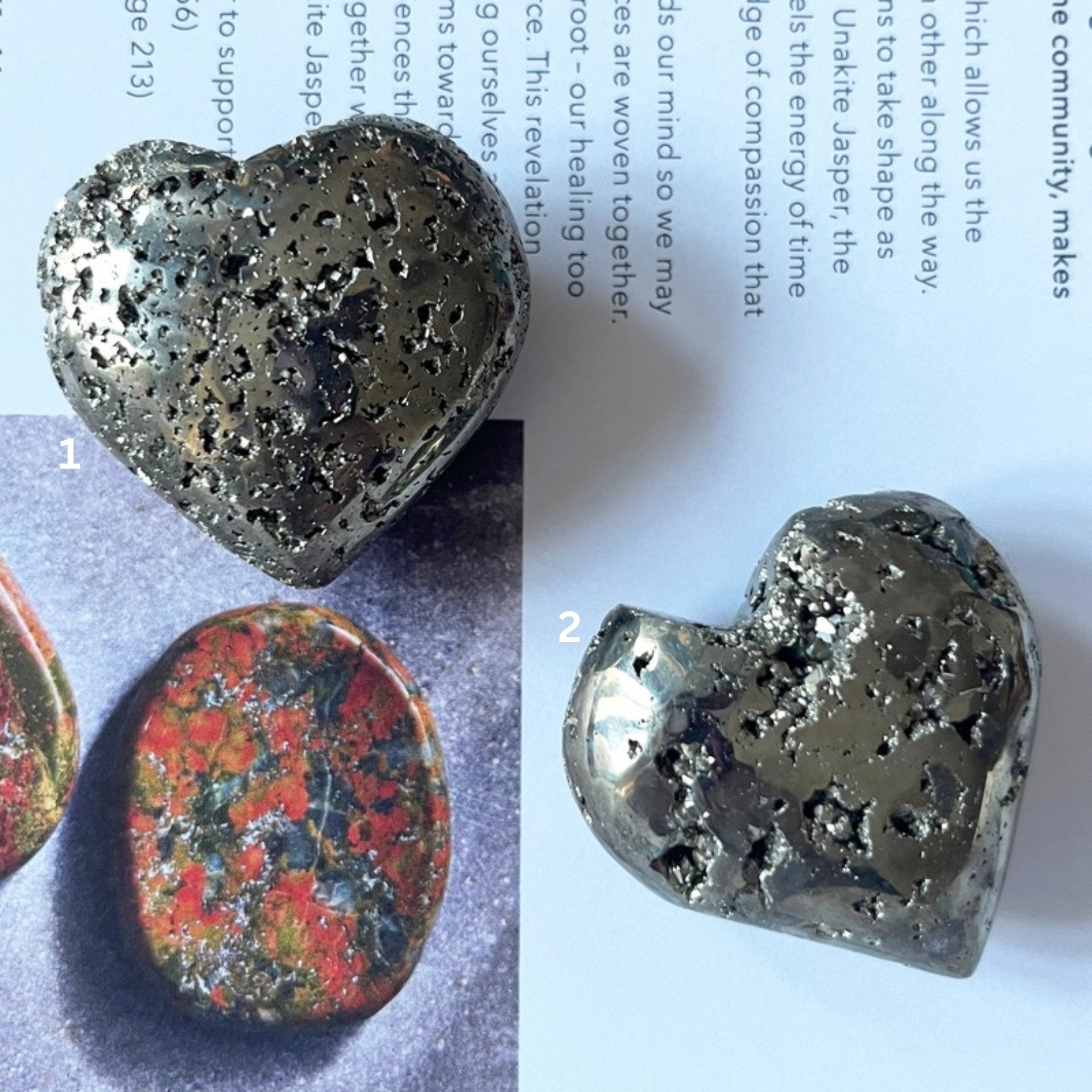 Pyramid heart held in a hand with a printed document in the background