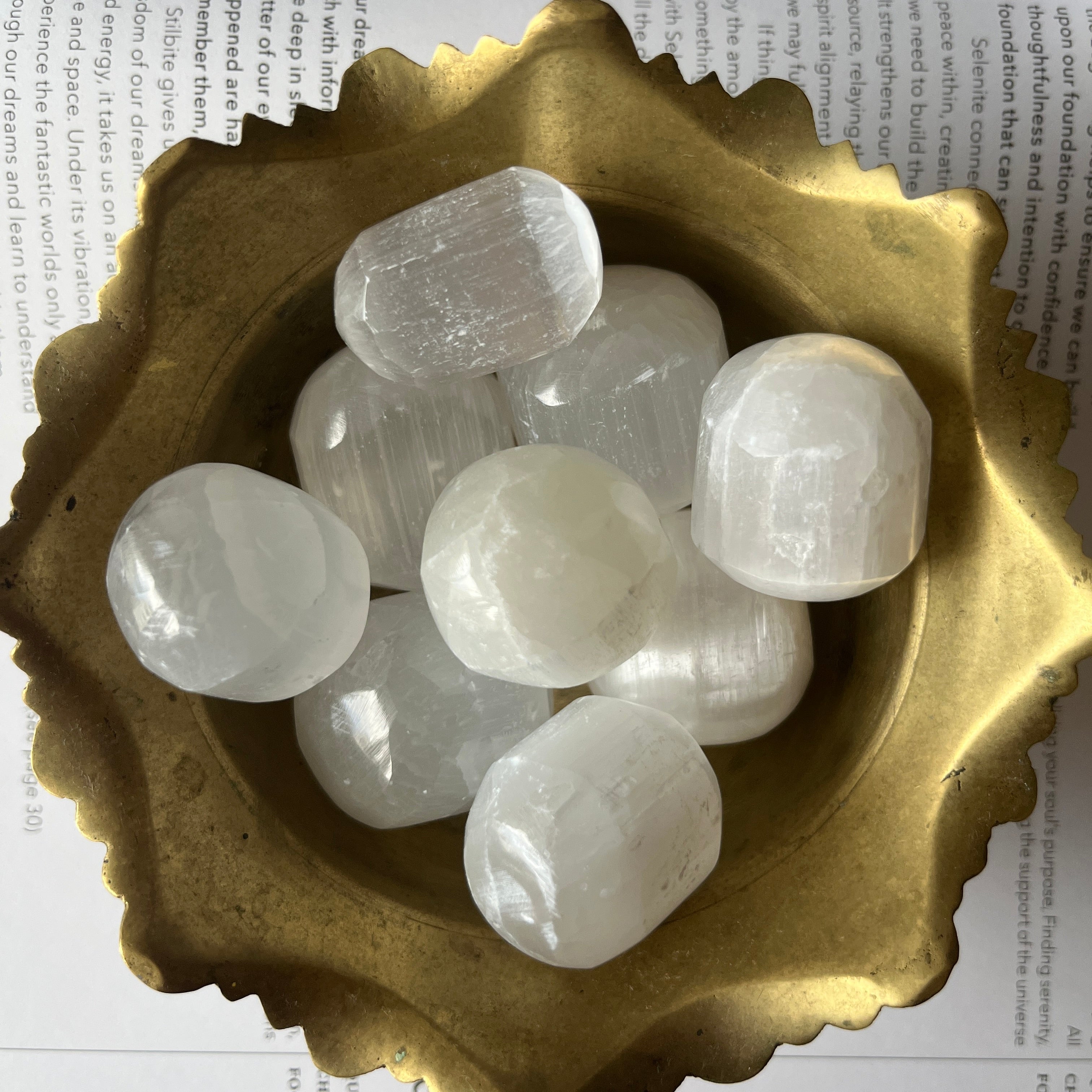 Selenite (Satin Spar) Tumblestones in a gold bowl