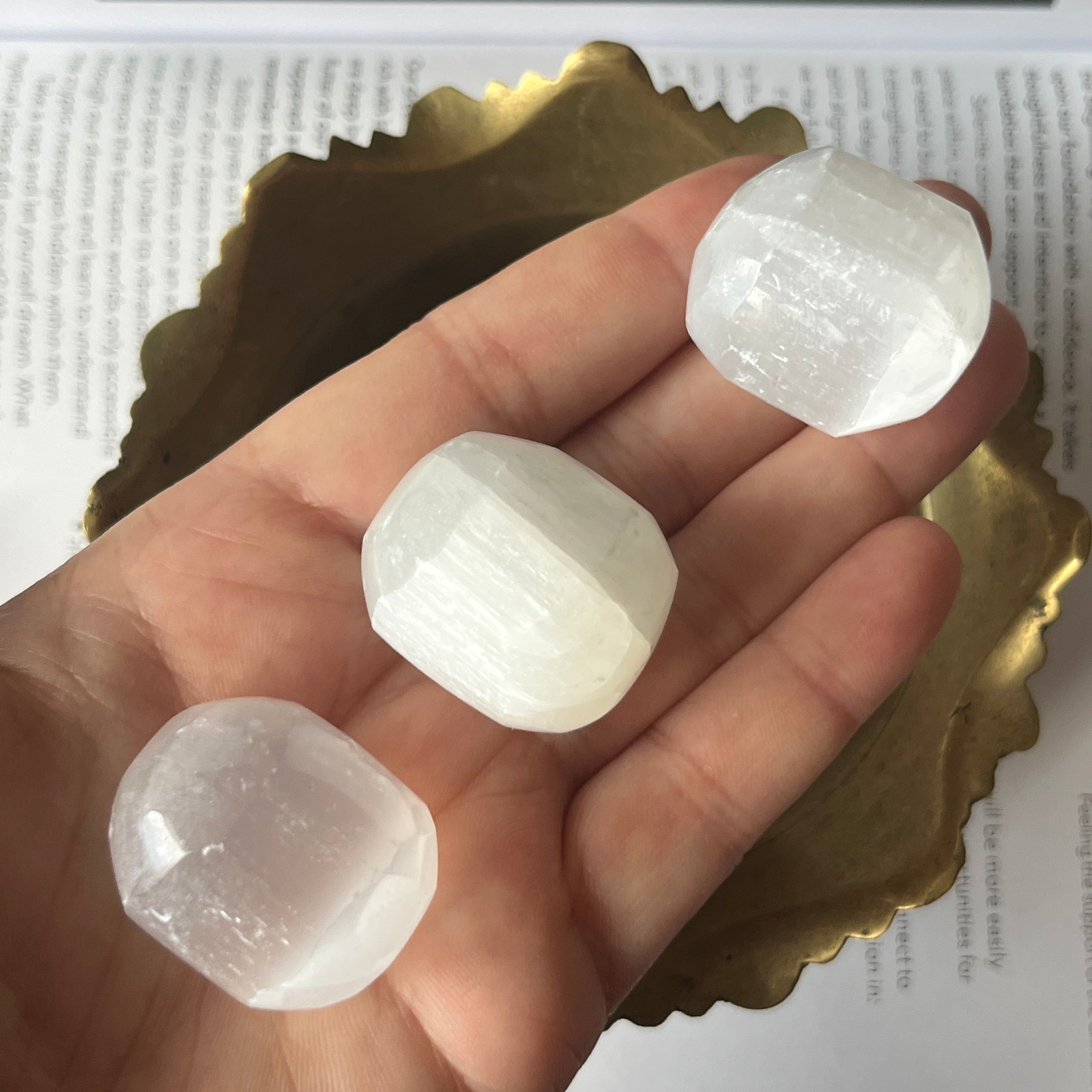 Selenite (Satin Spar) Tumblestones in a gold bowl