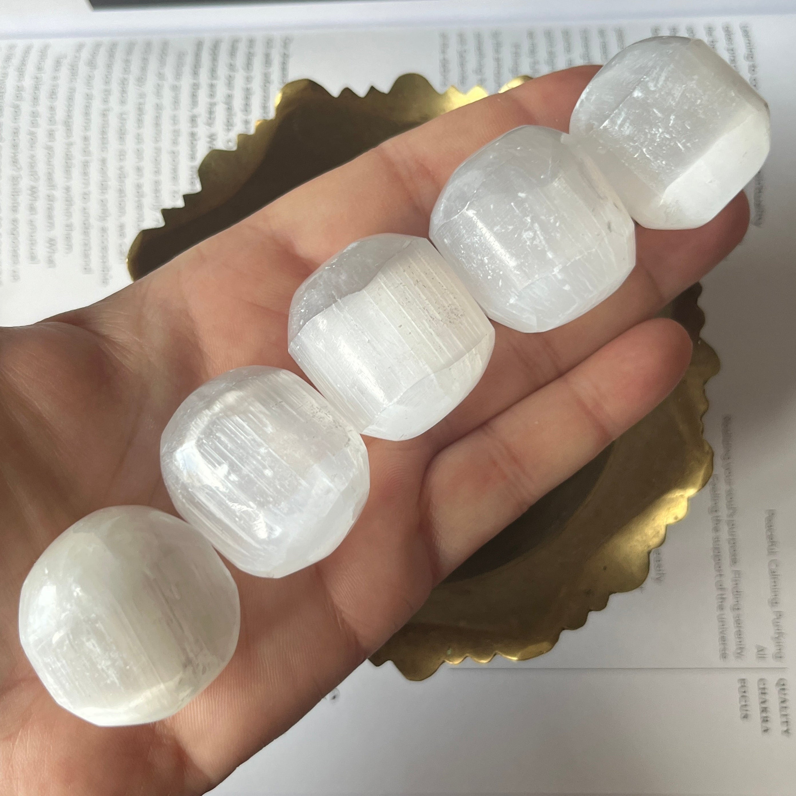 Selenite (Satin Spar) Tumblestones in a gold bowl